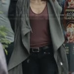 Tess’s long green jacket and black zip pocket jeans on Beauty and the Beast