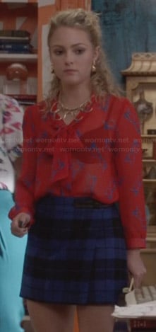 Carrie's red glasses print blouse and blue plaid skirt on The Carrie Diaries