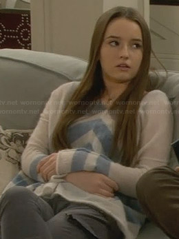 Eve’s white sweater with blue chevron stripes on Last Man Standing