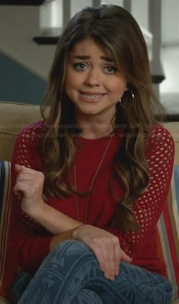 Haley's red mesh sleeve sweater and printed jeans on Modern Family