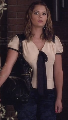 Hanna's white blouse with black contrast bow on Pretty Little Liars