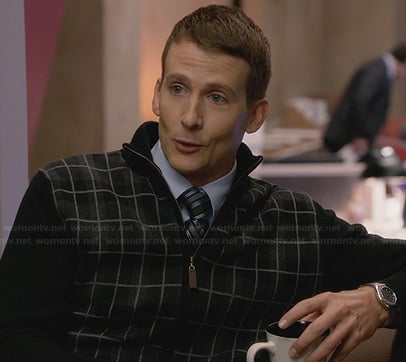 JC’s black plaid zip front sweater on House of Lies