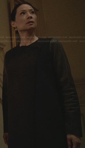 Joan's black coat with leather sleeves on Elementary