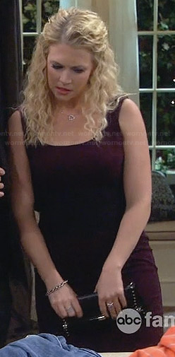 Mel’s purple dress with lace waist and studded clutch on Melissa and Joey
