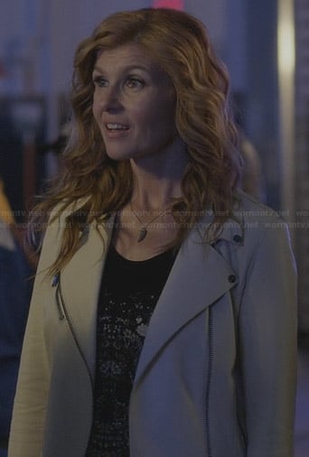 Rayna’s floral skull tee and white leather moto jacket on Nashville