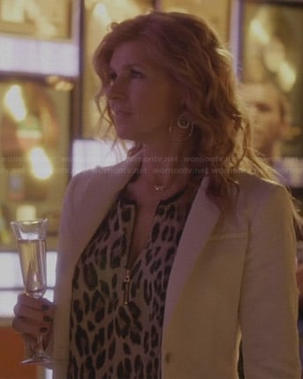 Rayna’s zip-front leopard print blouse and white textured blazer on Nashville