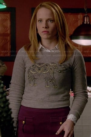 Daphne's grey elephant sweater and purple pocket front skirt on Switched at Birth