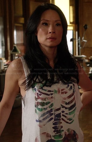 Joan's white skeleton graphic tank top on Elementary