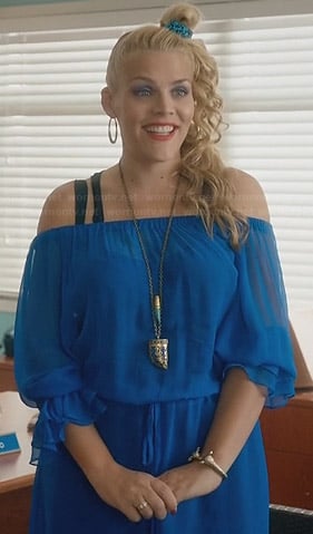 Laurie’s blue off-shoulder dress and horn necklace on Cougar Town