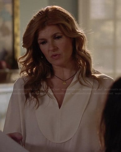 Rayna’s white bib front blouse on Nashville