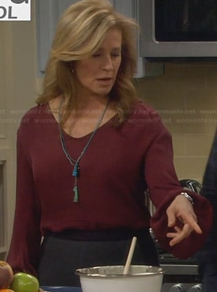 Vanessa’s red flared sleeve blouse on Last Man Standing