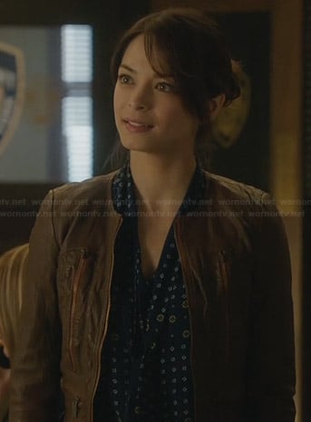 Cat’s blue floral blouse and brown leather jacket on Beauty and the Beast