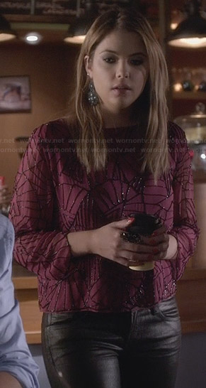 Hanna’s sheer red beaded blouse on Pretty Little Liars