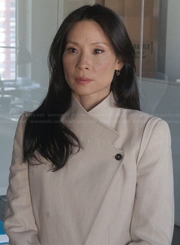 Joan's cream asymmetric coat on Elementary