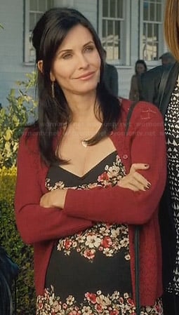 Jules's black floral dress and red pointelle cardigan on Cougar Town