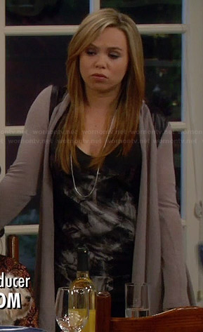 Kristin’s black graphic tank top and taupe cardigan with leather shoulders on Last Man Standing