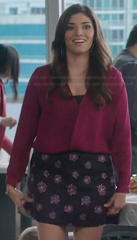 Lauren’s red wrap blouse and purple floral skirt on The Crazy Ones