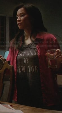 Joan’s grey “Night Moves of New York” tee on Elementary
