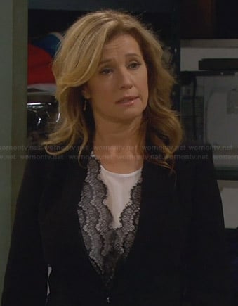 Vanessa's white blouse with black lace front on Last Man Standing