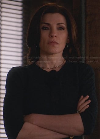 Alicia's navy tweed jacket with black trim on The Good Wife