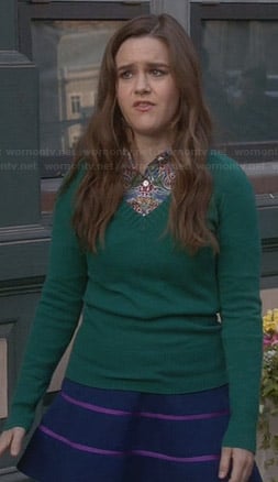 Betsey's blue skirt with pink stripes and green sweater on The Mindy Project