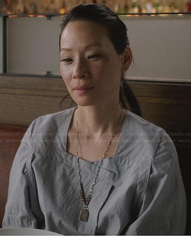 Joan's light grey wide sleeve dress on Elementary