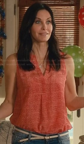 Jules’s red printed split-neck sleeveless top on Cougar Town