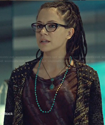 Cosima's burgundy printed dress with gathered side and studded cardigan on Orphan Black