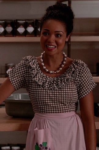 Beth's brown houndstooth ruffled dress and pearl necklace on Chasing Life