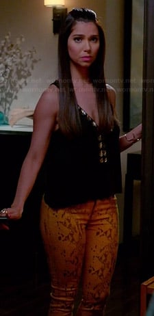 Carmen’s yellow leather look pants and black beaded top on Devious Maids