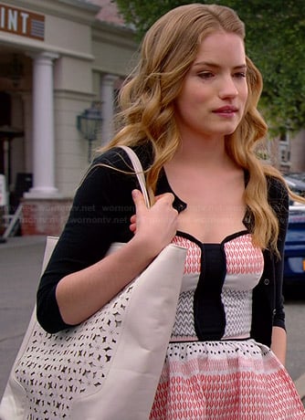 Emma’s red and white patterned dress with black panel and cutout bag on Royal Pains