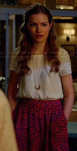 Emma's white mixed print top and pink floral skirt on Royal Pains