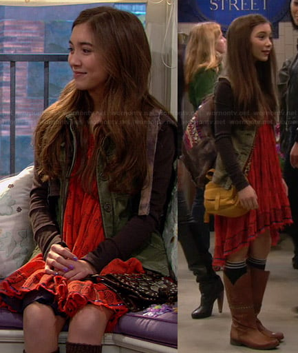 Riley’s orange printed dress, green jacket, tan boots and embellished backpack on Girl Meets World