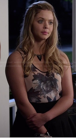 Ali's blue sleeveless floral top and black skirt on Pretty Little Liars