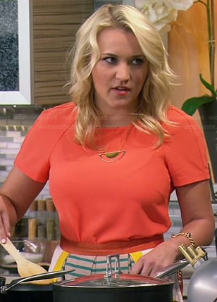 Gabi's orange short sleeved dress and striped apron on Young and Hungry