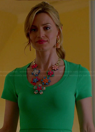 Paige’s green short sleeved dress and flower necklace on Royal Pains