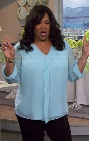 Yolanda’s light blue ruffle front blouse on Young and Hungry