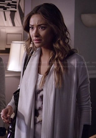 Emily’s white graphic tank top and draped cardigan with leather panels on Pretty Little Liars