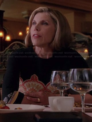 Diane’s black and orange printed dress on The Good Wife