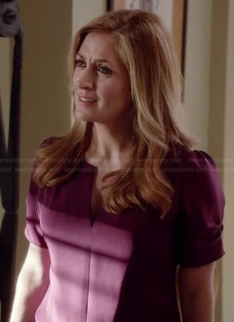 Maura’s purple split neck blouse with ruched sleeves on Rizzoli and Isles