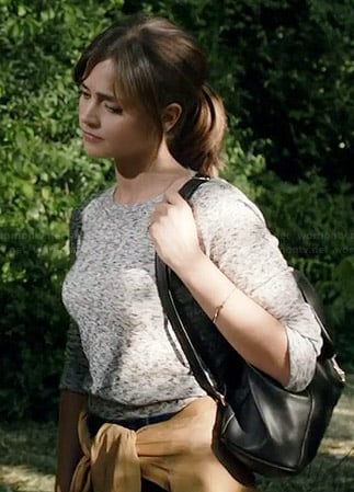 Clara’s grey sweater and leather backpack on Doctor Who