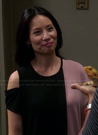 Joan's pink and black colorblock shoulder cutout dress on Elementary