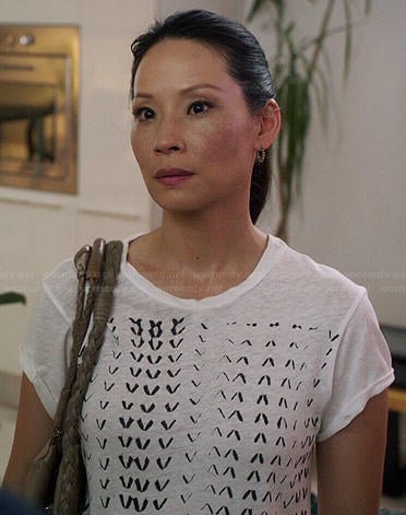 Joan's white chevron printed tee on Elementary