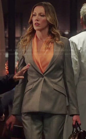 Laurel’s orange blouse and grey blazer on Arrow