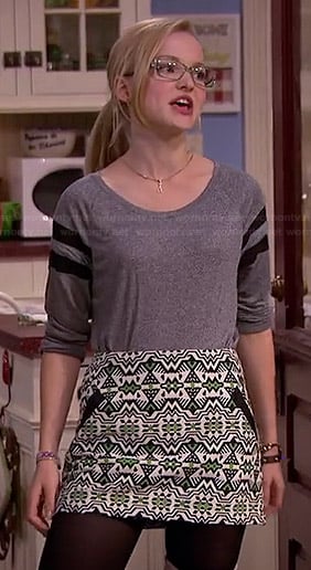 Maddie’s grey varsity tee and green printed mini skirt on Liv and Maddie