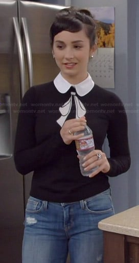 Mandy’s black and white collared bow sweater on Last Man Standing