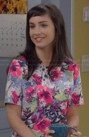 Mandy’s bright floral print top with zip back on Last Man Standing