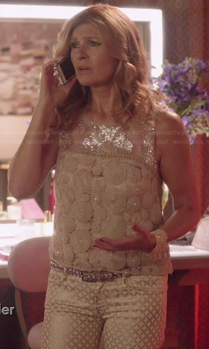 Rayna's sheer embellished dot top and gold printed jeans on Nashville