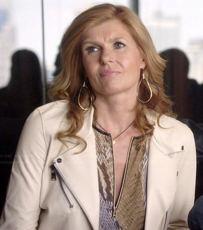 Rayna’s snake print zip-front top and white leather jacket on Nashville