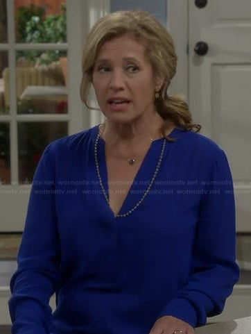 Vanessa’s blue long sleeved v-neck blouse on Last Man Standing